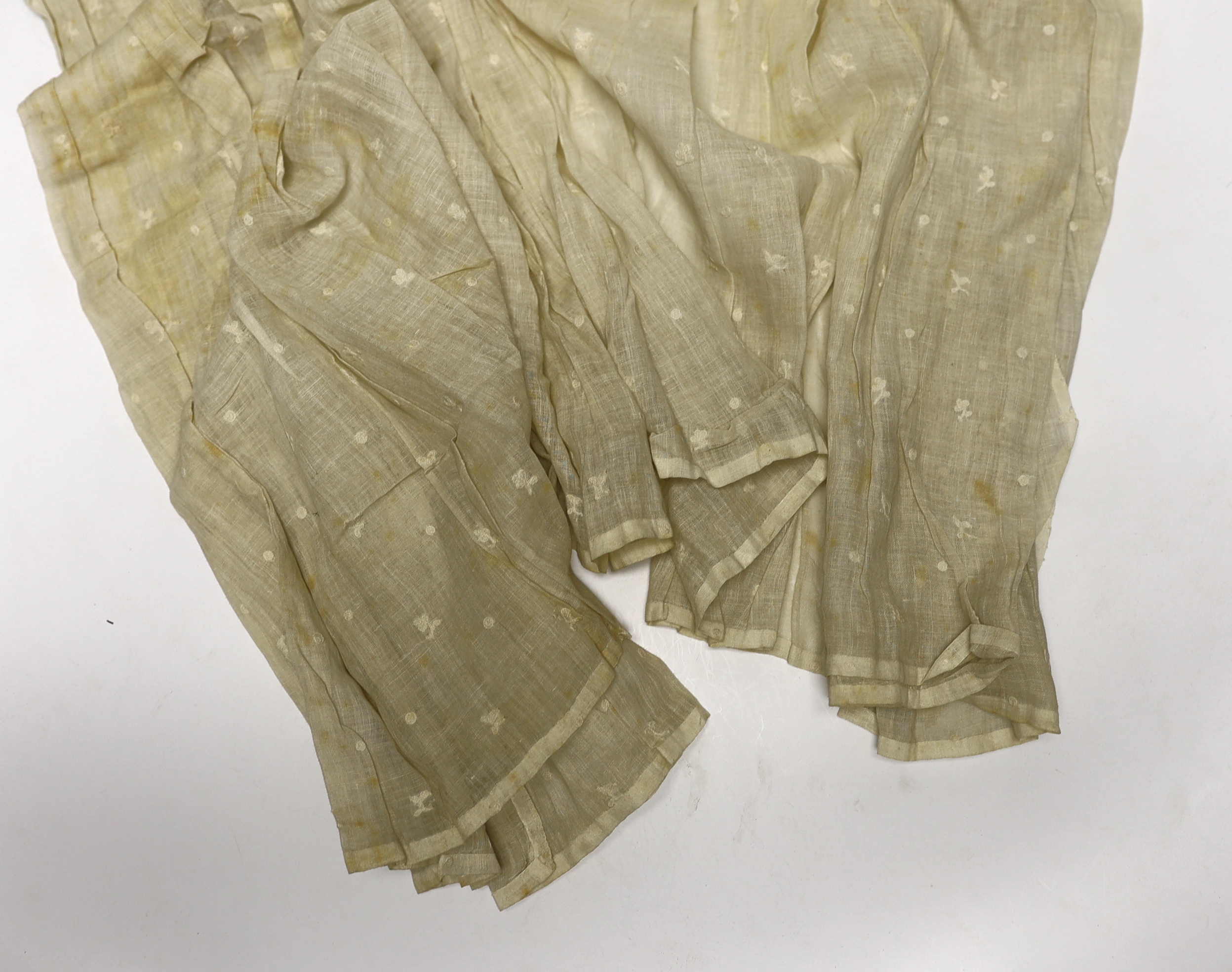 An early 18th century Hollie point insertion baby’s linen vest, three baby bonnets with Hollie point insertions and an early 18th century pair of Flemish bobbin lace lappets, a partly finished needlepoint length of lace,